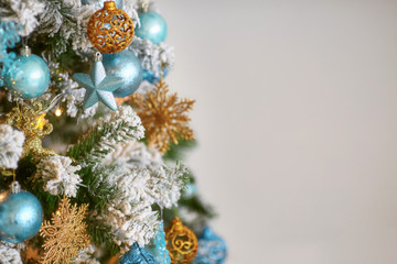 Decorated christmas tree on blurred defocused background