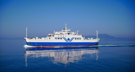 big transportation ferryboat sailing in blue calm water