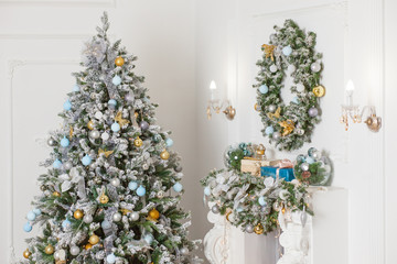 Christmas tree in the background with white decorations