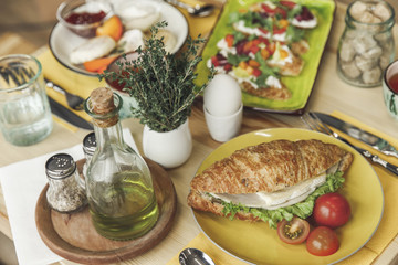close-up view of tasty healthy breakfast with sandwich and boiled egg on table