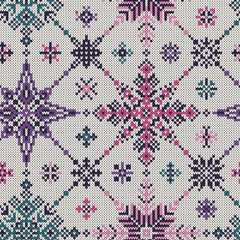 Seamless knitted pattern of colored snowflakes