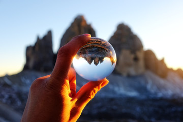 Tre Cime mountain view through crystal glass globe