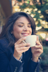 Young woman enjoy in coffee .