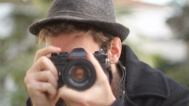 Photographer With Beard Takes Photo With Vintage Camera