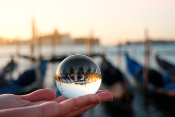 Fototapeta na wymiar Venice gondola view through crystal glass ball