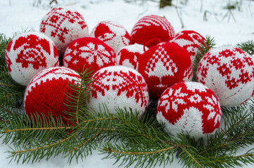 Fototapeta na wymiar Knitted balls for New Year tree decoration