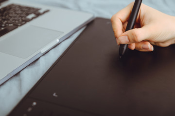Graphic Tablet Being Used with a Pen by Female Hand