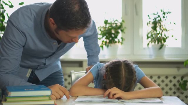 Dad is angry because his daughter don't want to do her homework.