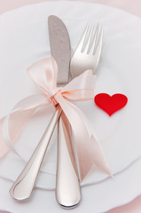 Christmas table place setting with christmas decorations