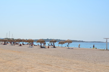 people relaxing on European beach