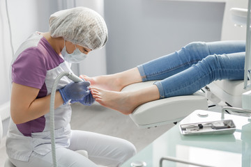 Podiatry doctor. Treatment of feet and nails. - obrazy, fototapety, plakaty