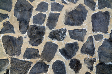 Decorative stone as a background.The decorative stone wall texture.
Selective focus.