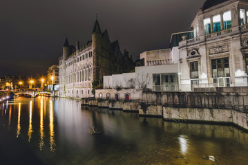 Fototapeta premium Gerald the Devil castle or Geeraard de Duivelsteen by night illumination. Famous gothic architecture building and tourist landmark in Ghent, East Flanders, Belgium.
