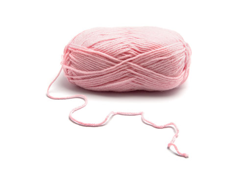 Pink knitting yarn isolated on white