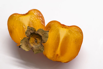Fresh ripe persimmons isolated on white background. Fresh Persimmon fruit