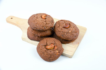 Cashews cookie on wooden boards and white background.