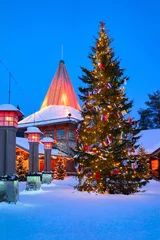 Fotobehang Arctic Circle lamps at Santa Office in Santa Village evening © Roman Babakin