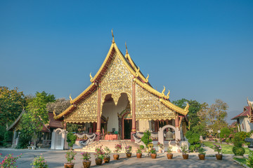 traditional buddhist temple with gemstones decorations in thailand.