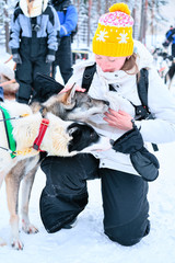 Girl and Husky dog Finnish Lapland winter Finnish forest