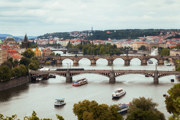 Fototapeta na wymiar Panoramic view on Vltava river and historical center of Prague, buildings and landmarks of old town, Prague, Czech Republic Beautiful Prague in cloudy weather.