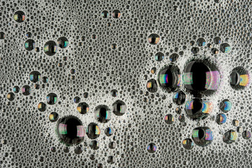Foam bubble suface texture on dark black background top view photo hi resolution