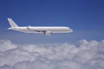 Naklejka na ściany i meble Passagierflugzeug über den Wolken