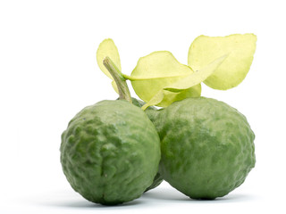 close up group of fresh bergamot with green leaves isolated on white background. benefits of bergamot for beauty and health concept
