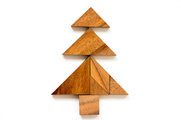 Wood tangram puzzle in christmas tree shape on white background