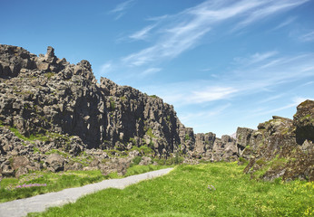 walkway in Thingvellir National Park, Iceland. Thingvellir National Park - famous area in Iceland right on the spot where the atlantic tectonic plates meets. UNESCO World Heritage Site