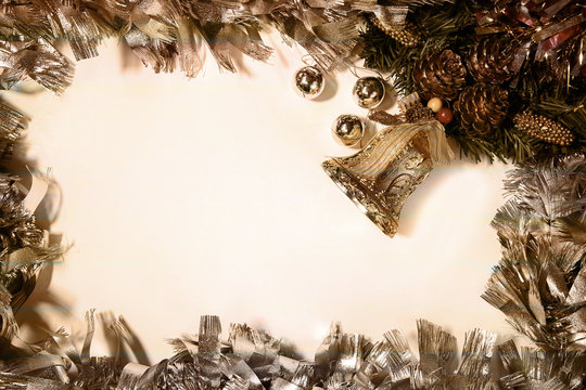 Christmas border with holly, mistletoe , christmas tree and gold ornamental with copy space