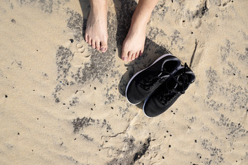 Footprint on brown sand wiith the beautiful beach in France.