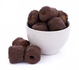 Crunchy corn chocolate snacks on a white background