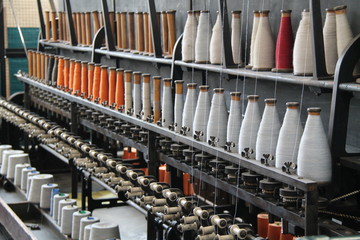 Threads and Spools on a Vintage Textile Machine.