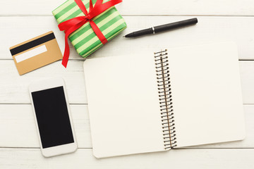 Christmas wish list on wood table background