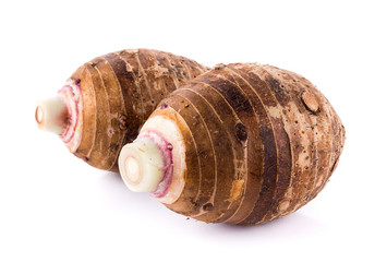 taro roots on white background
