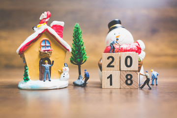 Miniature people : worker team building wooden block number 2018