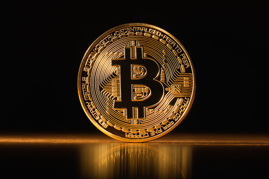 Golden glowing  Bitcoin