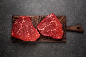 Papier Peint photo Lavable Steakhouse Raw meat, beef steak on dark background, top view and copy space