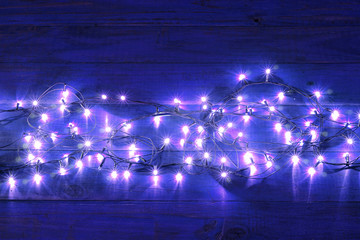Fairy Lights on Wooden Background
