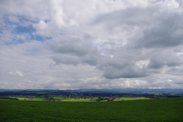 Obraz na płótnie Canvas clouds green landscape