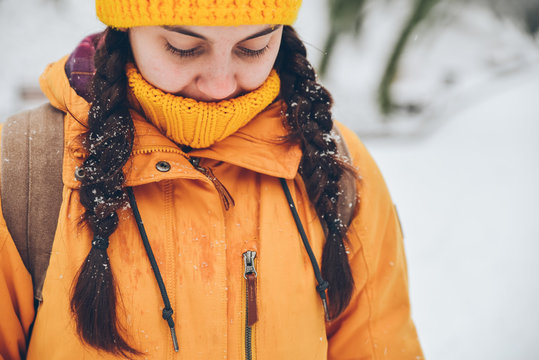 portrait of young pretty woman in snowy day