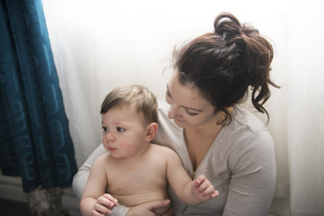 Mother with children close to the window