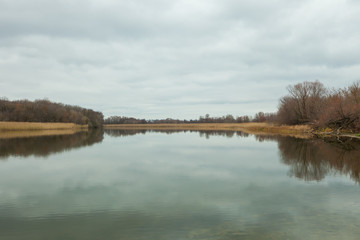 Landscape. Lake in the autumn, in cloudy weather.