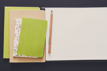 Mockup with set of various colorful notebooks