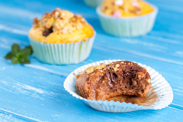 Fresh muffins with nuts and chocolate