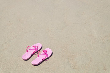Fototapeta na wymiar Pink sandal on Tien Beach at Koh Larn Island in Thailand.