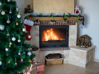 New Year's background with a fireplace and a Christmas tree. Festive mood