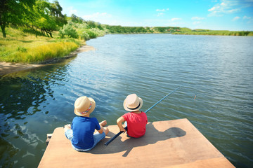 Fototapeta premium Cute children fishing on summer day