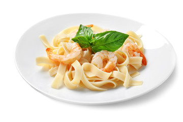 Plate of tasty pasta with shrimps on white background