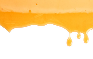 Sweet honey flowing on white background